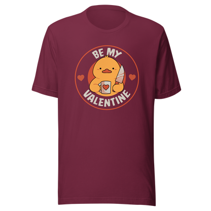 A cute duckling holding a heart-shaped coffee mug and a small knife, paired with the phrase ‘Be My Valentine Funny Duck’. A playful mix of cuteness and dark humor, perfect for coffee lovers and fans of ironic, quirky art.