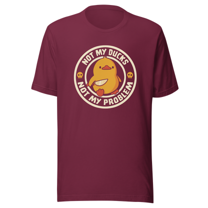 A cute yellow duck holding a tiny knife with an unexpectedly fierce attitude. Around it, the phrase "Not My Ducks Not My Problem" adds a sarcastic twist to the sweet but chaotic vibe. A playful design that blends humor, duck drama, and a touch of unapologetic mischief, perfect for fans of witty, slightly unhinged art.