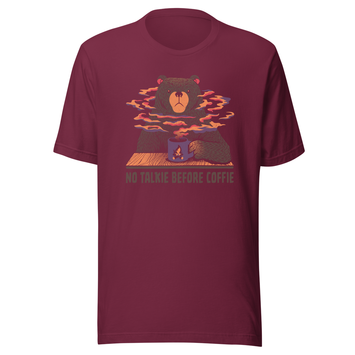 A large brown bear holding a purple coffee cup with a campfire design, with steam rising as if the coffee were piping hot. Below it appears the phrase ‘No Talkie Before Coffie’. A fun design for coffee lovers and anyone who isn’t ready to talk before their first cup.