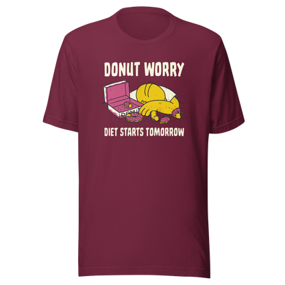 A playful design featuring a sleepy yellow cartoon character next to an open box of donuts, surrounded by crumbs and icing, with the phrase “Donut Worry Diet Starts Tomorrow”. Sweet, relatable and full of humor, it’s the perfect gift for donut lovers and anyone who believes diets can always start tomorrow.