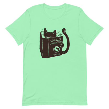 The design features a black silhouette of a cat peeking from behind an oversized book. The book's cover reads 'World Domination for Cats,' and includes a simple drawing of a globe. The cat's eyes are wide open, suggesting either surprise or intense focus on its 'world domination' plans.