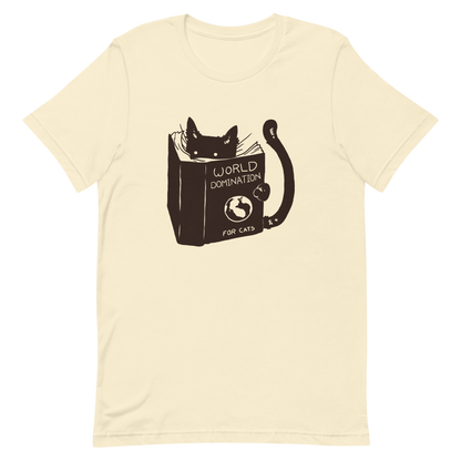 The design features a black silhouette of a cat peeking from behind an oversized book. The book's cover reads 'World Domination for Cats,' and includes a simple drawing of a globe. The cat's eyes are wide open, suggesting either surprise or intense focus on its 'world domination' plans.
