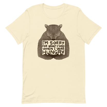 The image shows a humorous, detailed illustration of a bear, drawn in a hand-drawn style, holding a sign that reads 'I'm sorry for what I said when I was hungry.' The bear appears to be apologizing in a comical, endearing manner, making it a relatable and light-hearted design.
