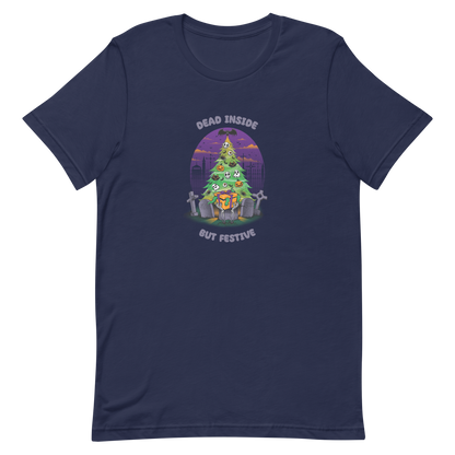 A quirky illustration features a Christmas tree decorated with skulls, pumpkins, and bats, set in a graveyard. The sky is purple and orange, with bats and tombstones surrounding the tree. A skeleton hand holds a festive gift box at the base. Above, text reads "Dead Inside" and below, "But Festive". The design combines Halloween and Christmas elements in a humorous style, highlighting a gothic and festive theme.