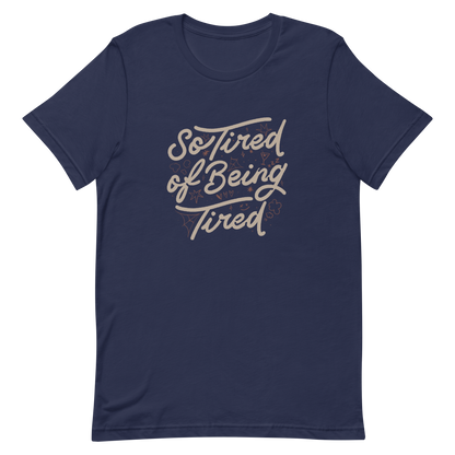 The artwork features the retro-style lettering "So Tired of Being Tired" surrounded by small icons like stars, hearts, clouds, and spider webs. This composition expresses the feeling of constant fatigue in a fun and stylish way. Ideal for those who bring humor to life and those who experience exhaustion in a lighthearted and humorous way.