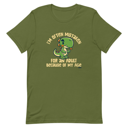 Cute cartoon dinosaur standing with a funny expression, accompanied by the humorous phrase “I’m Often Mistaken for an Adult Because of My Age” in bold distressed lettering.