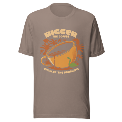 A giant retro-style coffee cup, with a little dinosaur strolling around and palm trees in the background. This design plays on the phrase "Bigger the coffee, smaller the problems," creating a cute and humorous scene about morning survival. Perfect for coffee lovers, dinosaur fans, and those who enjoy fun art.
