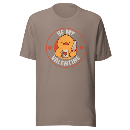 A cute duckling holding a heart-shaped coffee mug and a small knife, paired with the phrase ‘Be My Valentine Funny Duck’. A playful mix of cuteness and dark humor, perfect for coffee lovers and fans of ironic, quirky art.