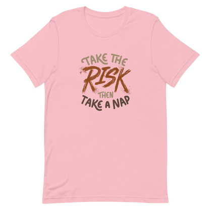 The artwork features bold lettering, "Take the Risk Then Take a Nap," with the word "Risk" highlighted in bold, energetic brushstrokes. This composition plays with the contrast between courage and rest, showing that taking risks is important, but so is recharging your batteries. Ideal for fans of fun quotes and those seeking lighthearted inspiration with a dash of humor.