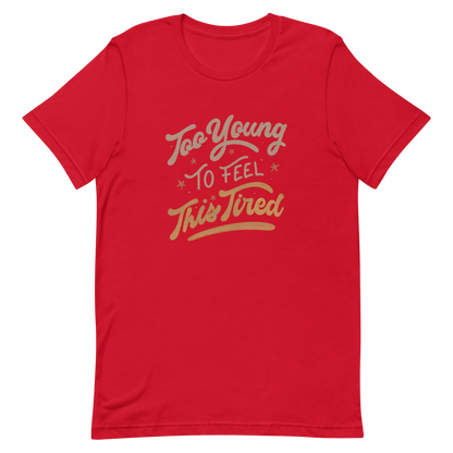 The artwork features the vintage-style lettering "Too Young To Feel This Tired," with touches of beige and gold, decorated with small stars. This playful phrase conveys the feeling of premature fatigue with an ironic and stylish touch. Ideal for young adults, students, and anyone who can relate to the daily struggle between energy and exhaustion.