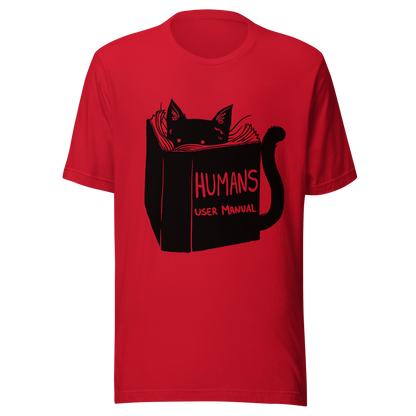A kitten peeking out from behind a huge book titled "Humans: User Manual". This design plays on the idea that cats are trying to figure out how to control us. Perfect for cat lovers, book fans, and anyone who enjoys lighthearted humor in prints.