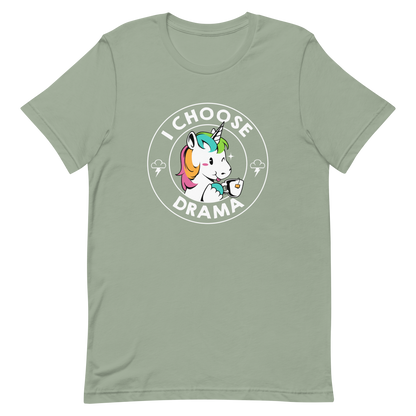 A cartoon unicorn with rainbow-colored mane holds a cup of tea and a heart, encircled by the words 'I Choose Drama'. Two small clouds with lightning bolts flank the unicorn, adding a playful yet slightly edgy vibe. The design is bold and whimsical with a pop-art influence.