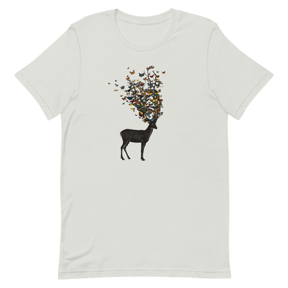 The image depicts a dark, silhouetted deer standing on a neutral background. Instead of branches, its antlers transform into a swirling cloud of vibrant, colorful butterflies that extend upwards and outward. The mix of organic and ethereal elements creates a captivating and whimsical visual contrast.