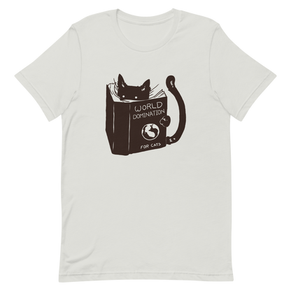 The design features a black silhouette of a cat peeking from behind an oversized book. The book's cover reads 'World Domination for Cats,' and includes a simple drawing of a globe. The cat's eyes are wide open, suggesting either surprise or intense focus on its 'world domination' plans.