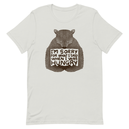 The image shows a humorous, detailed illustration of a bear, drawn in a hand-drawn style, holding a sign that reads 'I'm sorry for what I said when I was hungry.' The bear appears to be apologizing in a comical, endearing manner, making it a relatable and light-hearted design.