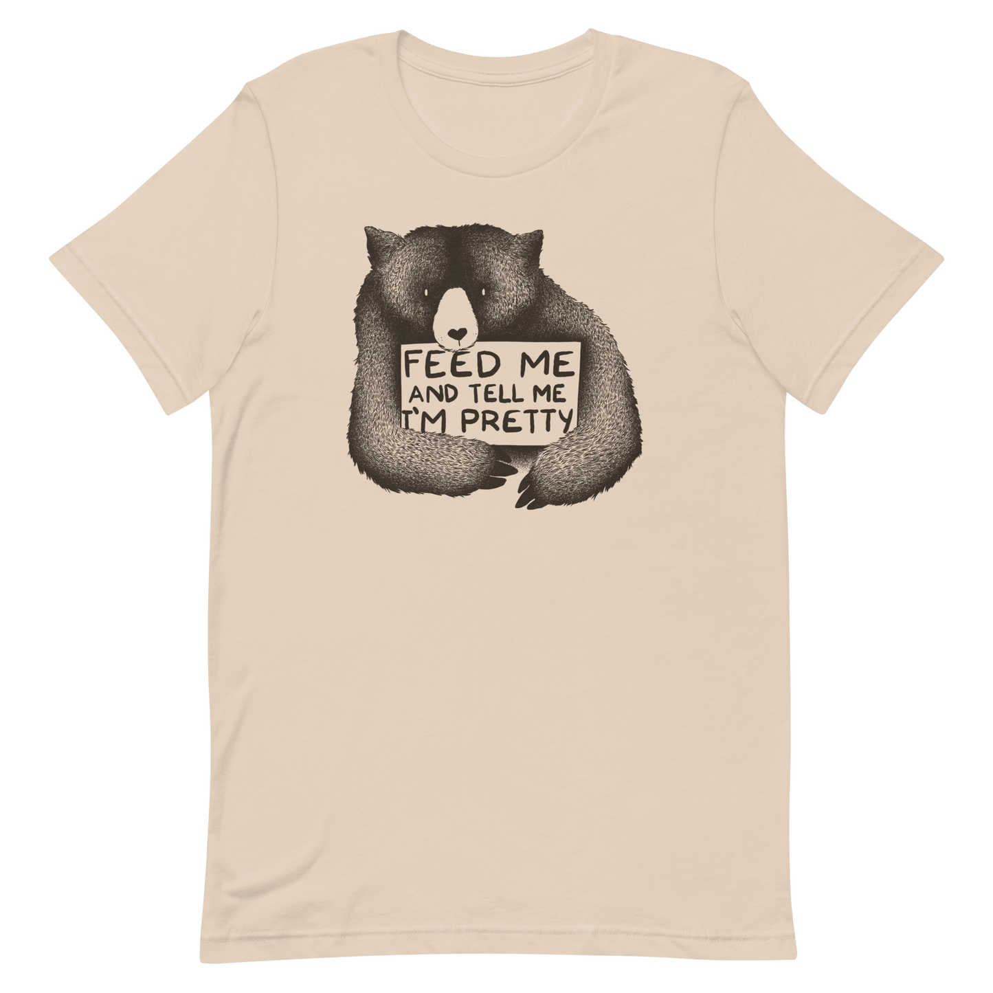 This drawing is of a cute, cartoon-style bear holding a sign with a heart-shaped nose and simple, expressive eyes. The sign reads, 'Feed me and tell me I'm pretty' in a handwritten, playful font. The bear's fur is detailed with fine, textured lines, giving it a cozy, endearing look. The drawing has a monochrome, black-and-white color scheme