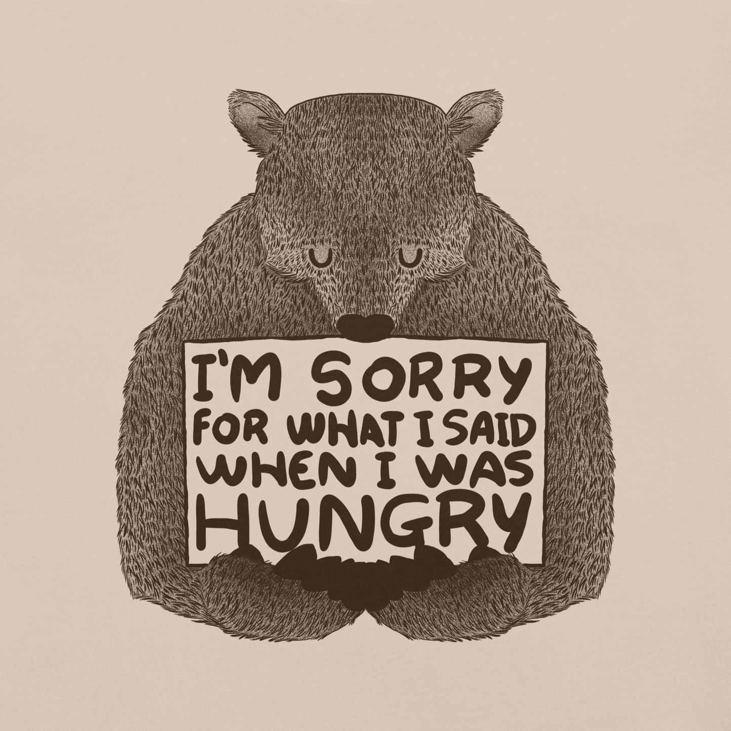 The image shows a humorous, detailed illustration of a bear, drawn in a hand-drawn style, holding a sign that reads 'I'm sorry for what I said when I was hungry.' The bear appears to be apologizing in a comical, endearing manner, making it a relatable and light-hearted design.