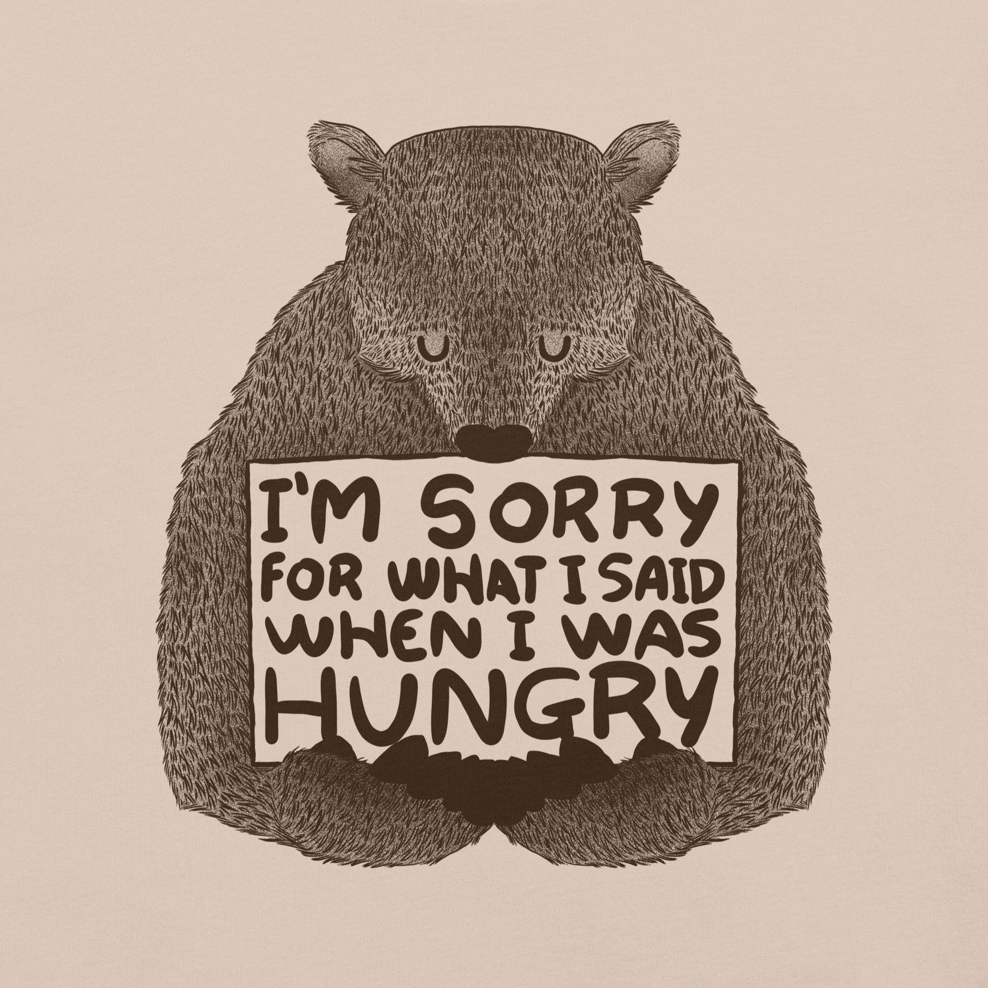 The image shows a humorous, detailed illustration of a bear, drawn in a hand-drawn style, holding a sign that reads 'I'm sorry for what I said when I was hungry.' The bear appears to be apologizing in a comical, endearing manner, making it a relatable and light-hearted design.