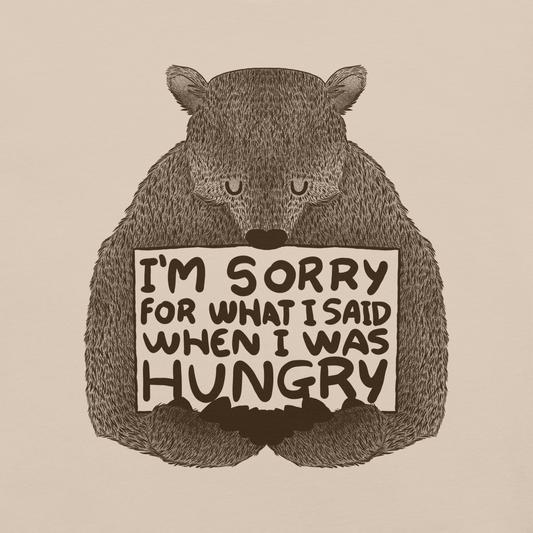 The image shows a humorous, detailed illustration of a bear, drawn in a hand-drawn style, holding a sign that reads 'I'm sorry for what I said when I was hungry.' The bear appears to be apologizing in a comical, endearing manner, making it a relatable and light-hearted design.