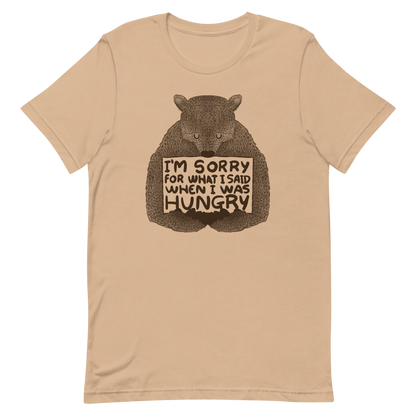 The image shows a humorous, detailed illustration of a bear, drawn in a hand-drawn style, holding a sign that reads 'I'm sorry for what I said when I was hungry.' The bear appears to be apologizing in a comical, endearing manner, making it a relatable and light-hearted design.