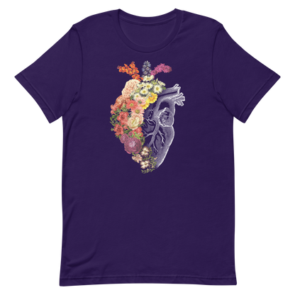 The design is an intricate and anatomical drawing of a human heart on a black background. The left side of the heart morphs into a vibrant assortment of colorful flowers, including roses, daisies, and other blooming blossoms, creating a striking contrast between the realistic and the surreal, symbolizing the harmony between nature and humanity.