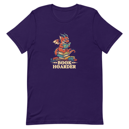 Perched atop his treasure trove of books, this red nerdy dragon is ready to devour epic adventures, magic tales, and fantasy worlds. The words 'BOOK HOARDER' are placed at the bottom of the design.