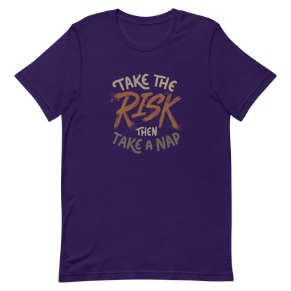 The artwork features bold lettering, "Take the Risk Then Take a Nap," with the word "Risk" highlighted in bold, energetic brushstrokes. This composition plays with the contrast between courage and rest, showing that taking risks is important, but so is recharging your batteries. Ideal for fans of fun quotes and those seeking lighthearted inspiration with a dash of humor.