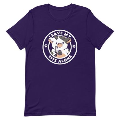 A quirky stamp-style design featuring a cute spotted cow holding a knife with the phrase “Leave My Tits Alone.” It mixes humor, attitude, and a playful call for animal respect. Perfect for cow lovers, fans of sassy humor, and anyone who supports animal rights.