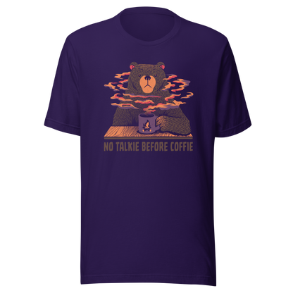 A large brown bear holding a purple coffee cup with a campfire design, with steam rising as if the coffee were piping hot. Below it appears the phrase ‘No Talkie Before Coffie’. A fun design for coffee lovers and anyone who isn’t ready to talk before their first cup.
