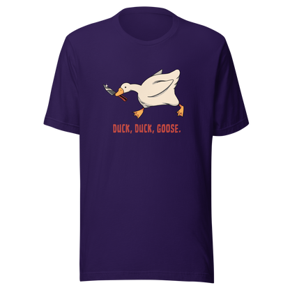 A white goose gripping a sharp knife in its beak with the phrase “Duck, Duck, Goose” below. A playful twist on the classic game, this design captures chaotic goose energy with a sharp dose of dark humor.