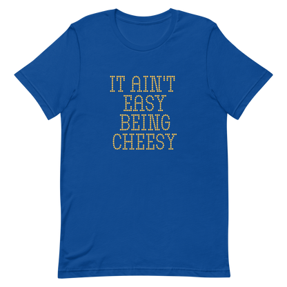 Bold dotted typography spells out ‘It Ain’t Easy Being Cheesy’ in a playful retro style on a yellow background. This funny design mixes wordplay with foodie humor, perfect for pun lovers, cheese fans, retro humor enthusiasts, and anyone who embraces the cringe with pride. A great quirky gift for cheese lovers and humor fans alike.