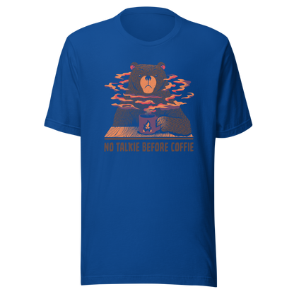A large brown bear holding a purple coffee cup with a campfire design, with steam rising as if the coffee were piping hot. Below it appears the phrase ‘No Talkie Before Coffie’. A fun design for coffee lovers and anyone who isn’t ready to talk before their first cup.