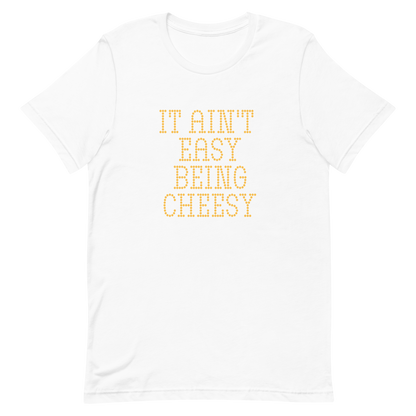 Bold dotted typography spells out ‘It Ain’t Easy Being Cheesy’ in a playful retro style on a yellow background. This funny design mixes wordplay with foodie humor, perfect for pun lovers, cheese fans, retro humor enthusiasts, and anyone who embraces the cringe with pride. A great quirky gift for cheese lovers and humor fans alike.