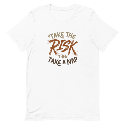 The artwork features bold lettering, "Take the Risk Then Take a Nap," with the word "Risk" highlighted in bold, energetic brushstrokes. This composition plays with the contrast between courage and rest, showing that taking risks is important, but so is recharging your batteries. Ideal for fans of fun quotes and those seeking lighthearted inspiration with a dash of humor.