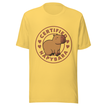 An art piece in warm beige and brown tones featuring a relaxed, sleepy capybara sitting peacefully beside the phrase “Certified Napybara”. A cozy, humorous design perfect for anyone who relates to slow days, loves capybaras, and fully embraces the art of taking naps.