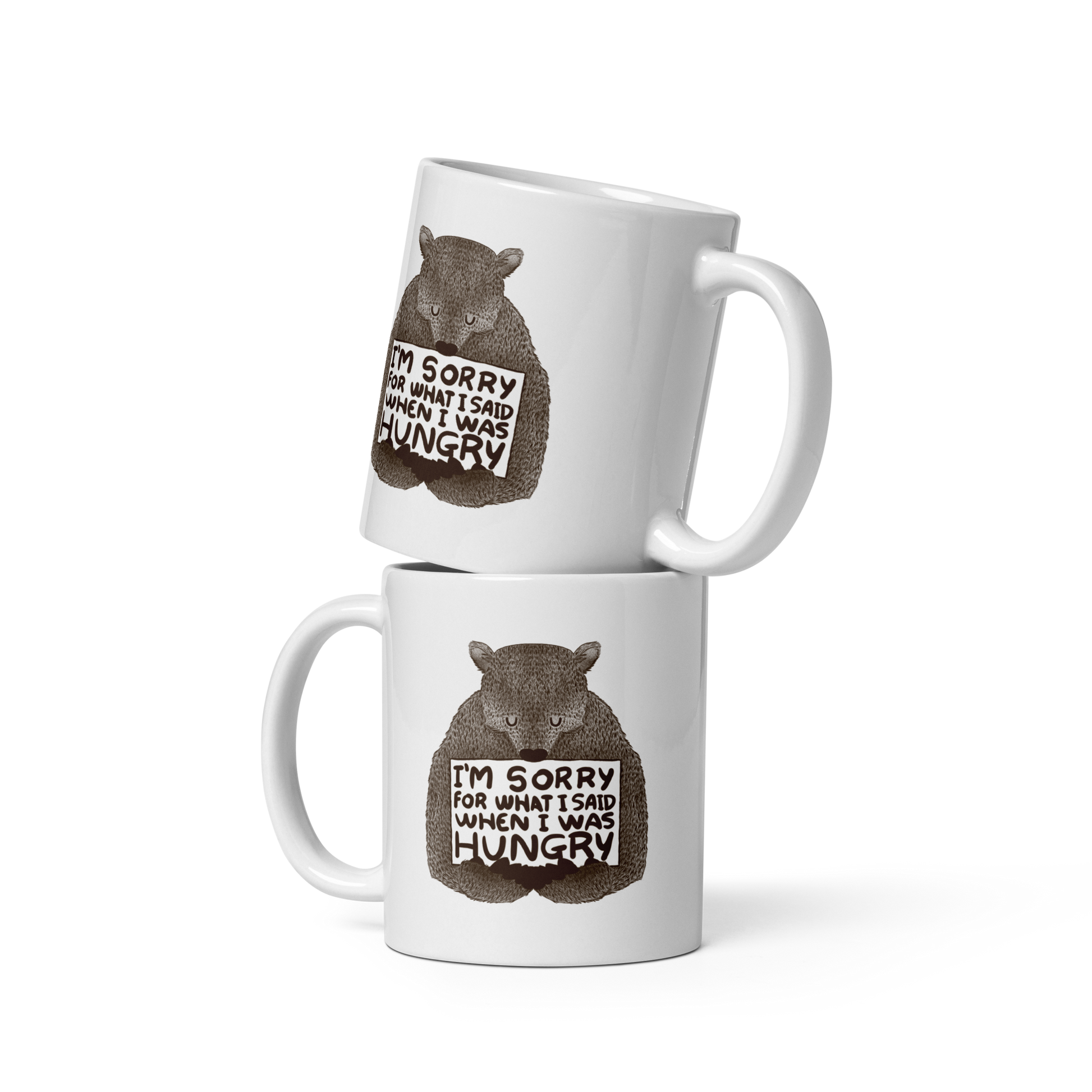 The image shows a humorous, detailed illustration of a bear, drawn in a hand-drawn style, holding a sign that reads 'I'm sorry for what I said when I was hungry.' The bear appears to be apologizing in a comical, endearing manner, making it a relatable and light-hearted design.