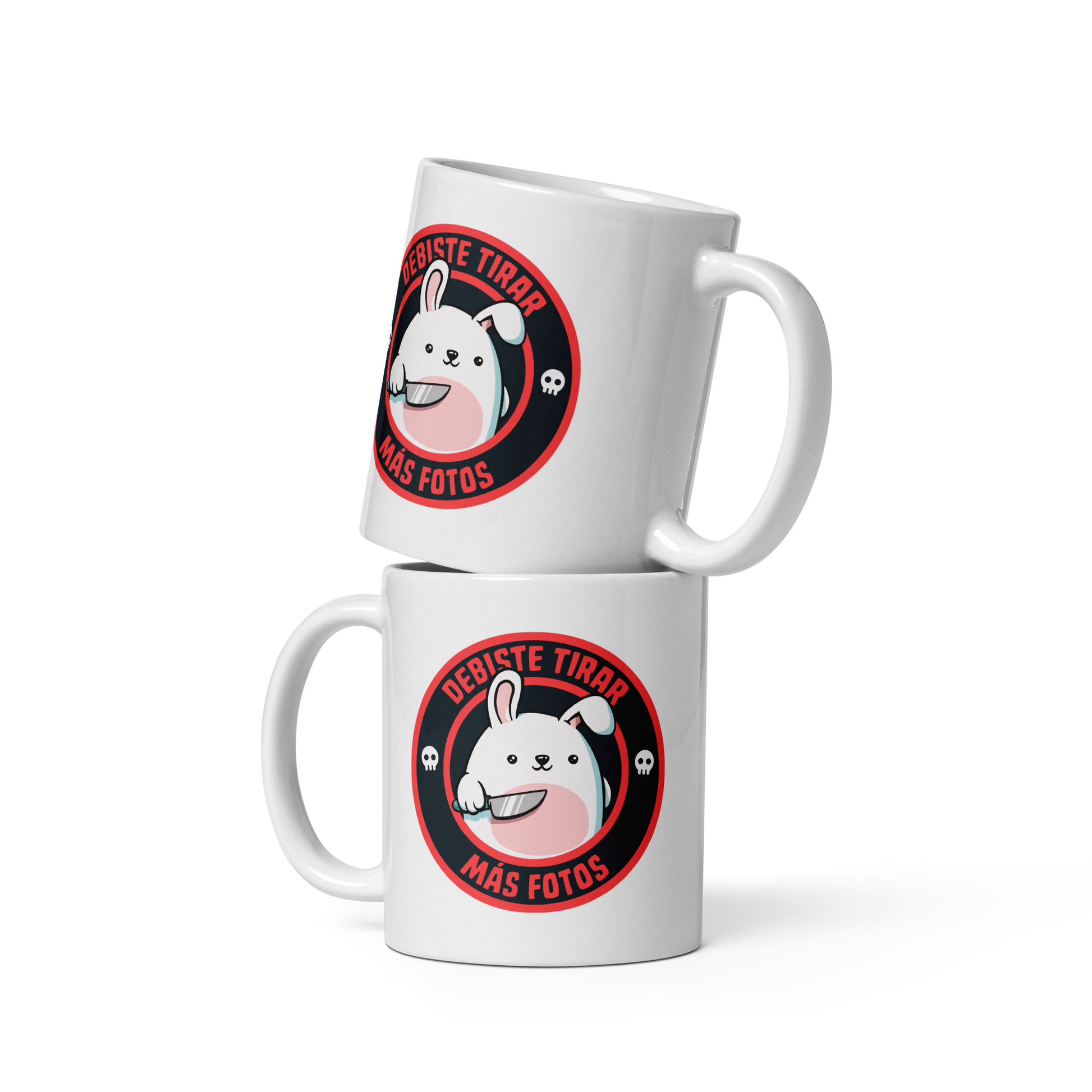 A cute white cartoon bunny with a pink belly stands holding a large kitchen knife in one paw. Surrounding the bunny is a red circular border with the words 'DEBISTE TIRAR MÁS FOTOS'. Small skull icons are on either side of the circle. The overall tone is a mix of adorable and ironic humor.